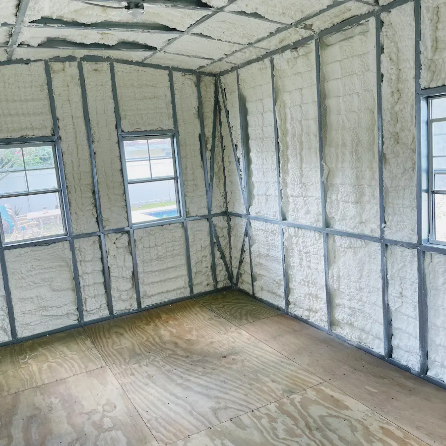 Closed-cell spray foam insulation applied to wall cavities in a residential project in Deming